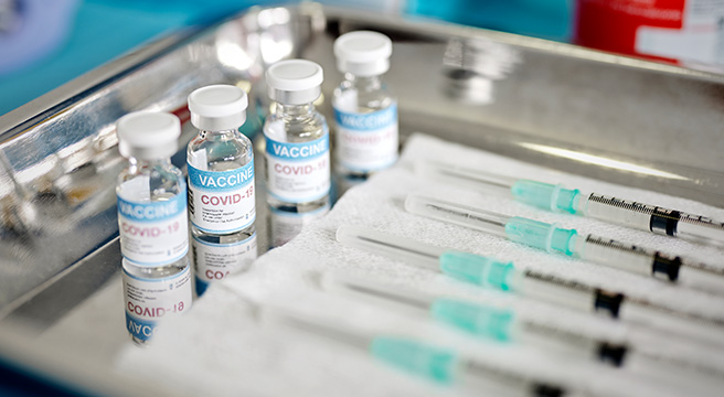 Photo: Image of COVID-19 vaccine vials and other supplies